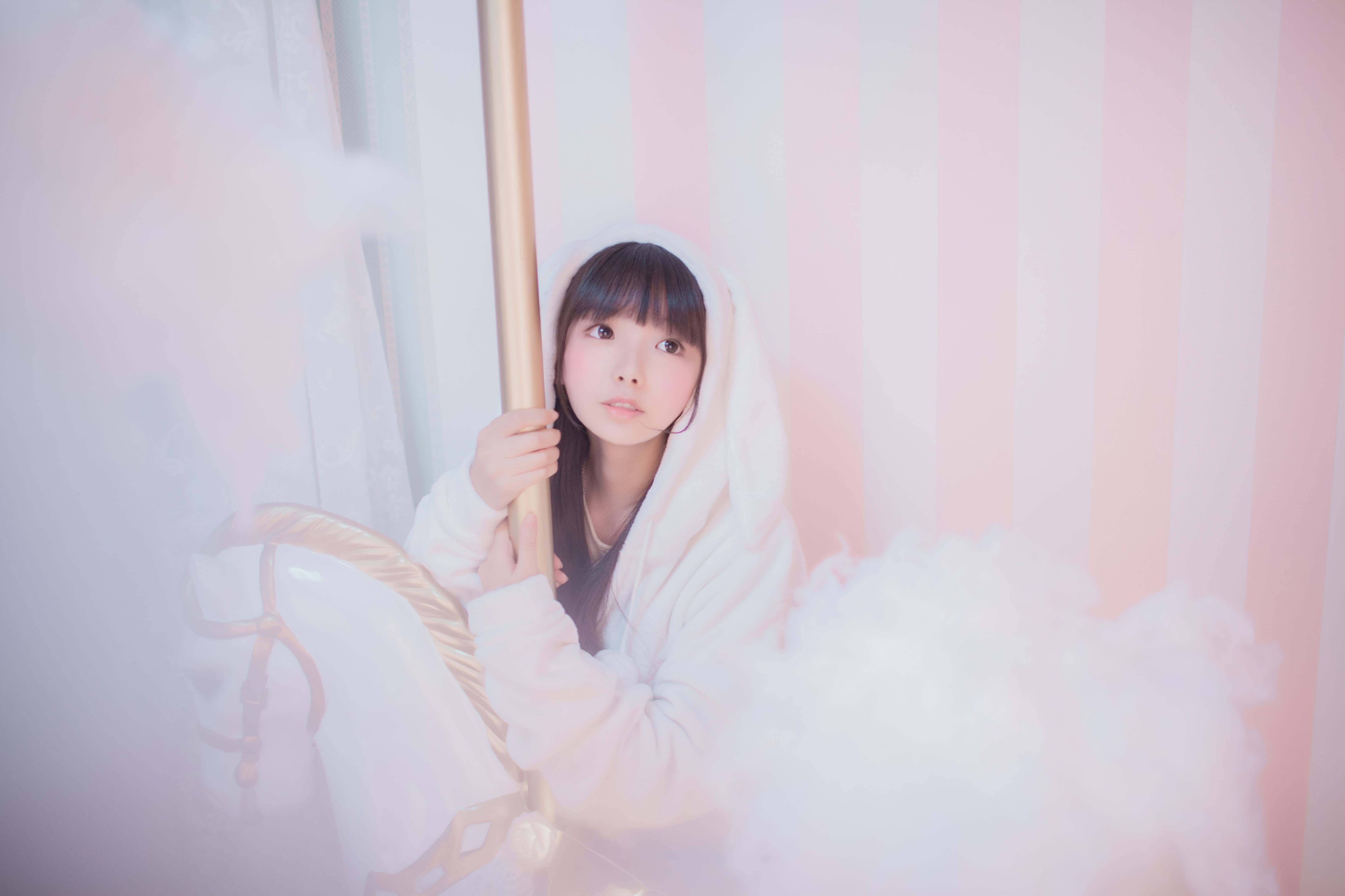 Detail of a single bare sole flashing between spinning heels and glossy rails